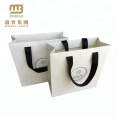 Low Cost Ribbon Handle White Gift Carrier Custom Made Design Logo Print Luxury Paper Shopping Bag